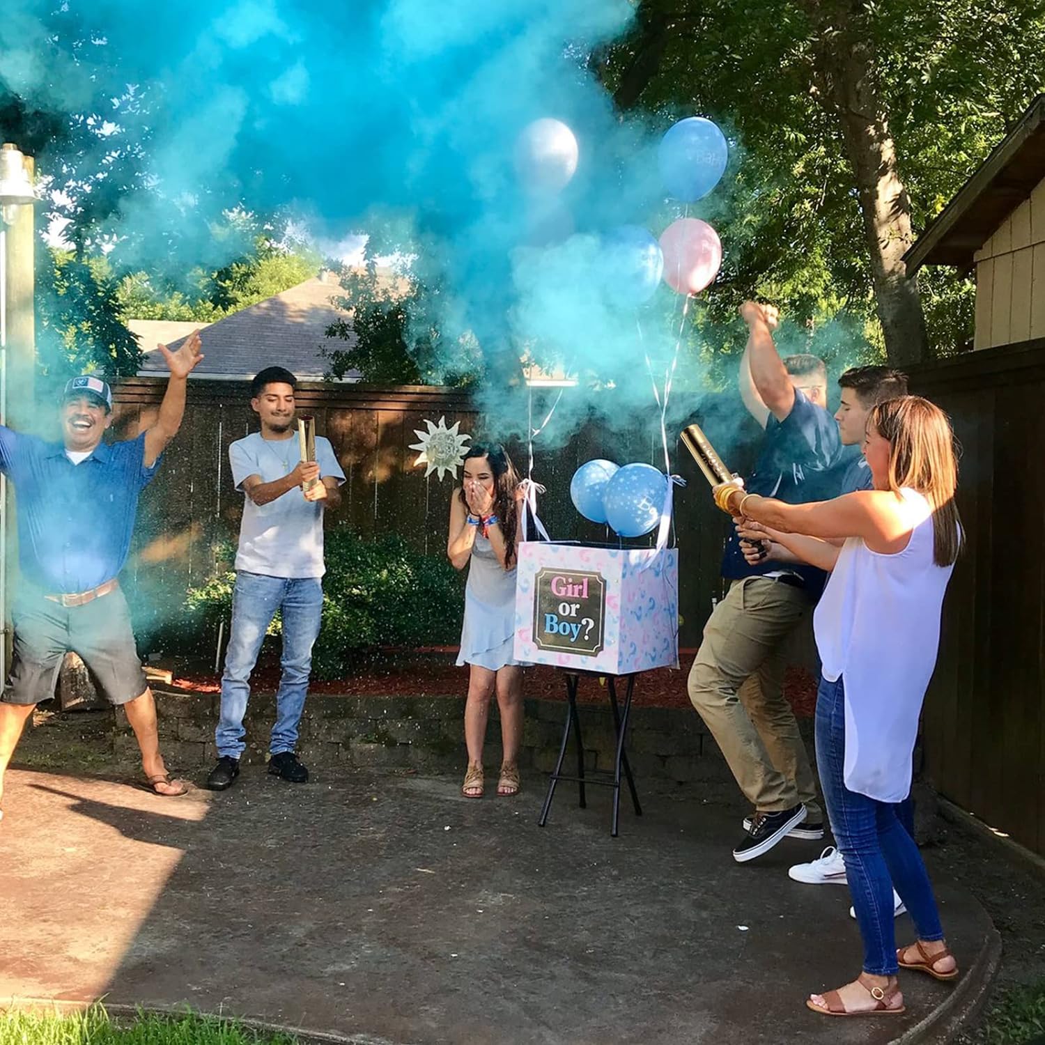 Family using Luxury Gender Reveal Cannon with blue powder outdoors